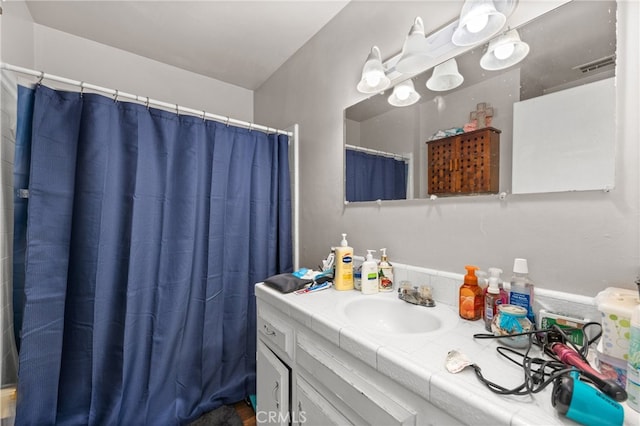 bathroom featuring visible vents and vanity