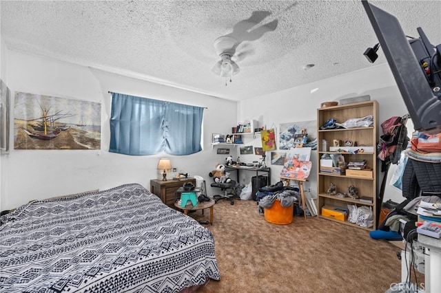 carpeted bedroom with ceiling fan and a textured ceiling