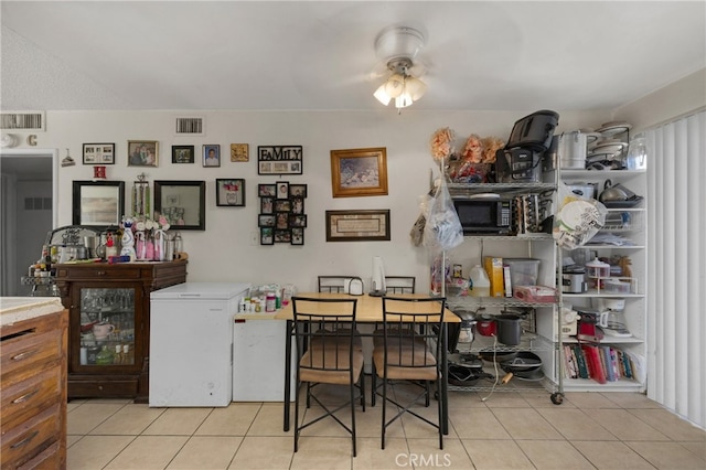 dining area with light tile patterned flooring