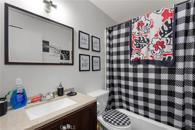 full bathroom with shower / tub combo with curtain, vanity, and toilet