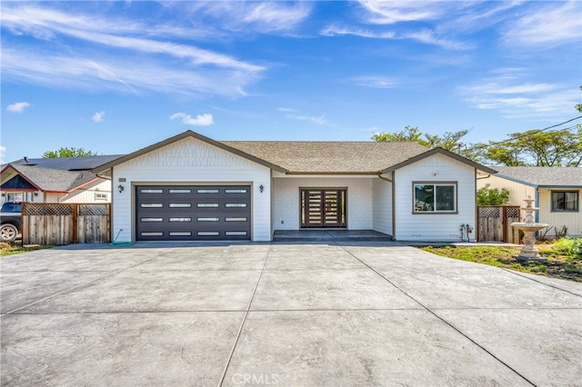 ranch-style home featuring a garage