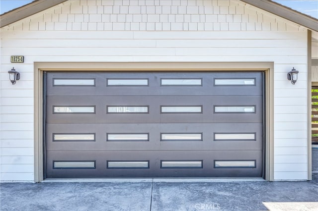 garage featuring wood walls