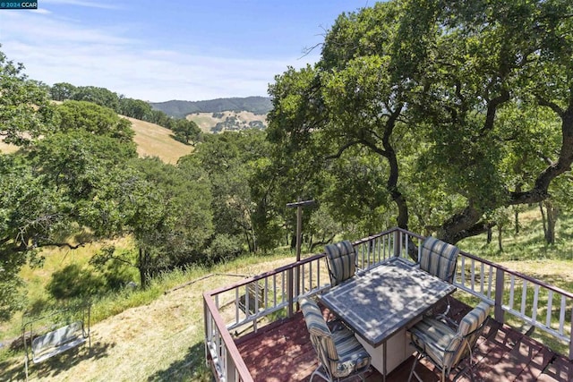 wooden deck featuring a mountain view