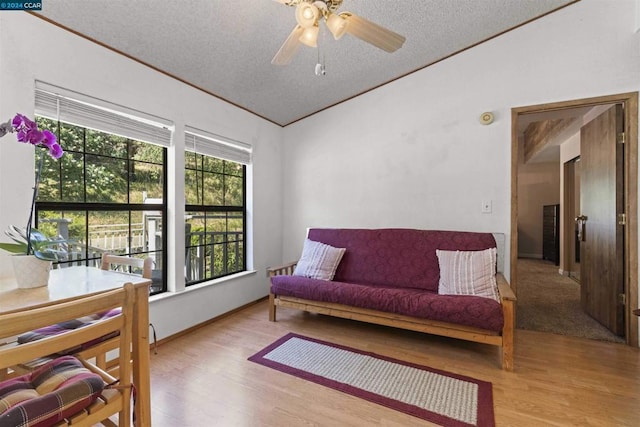 sitting room featuring ceiling fan, a textured ceiling, and light wood-type flooring