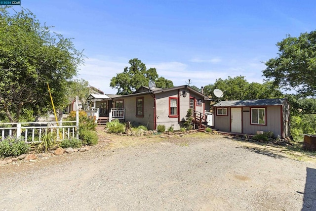 view of front of property with an outdoor structure