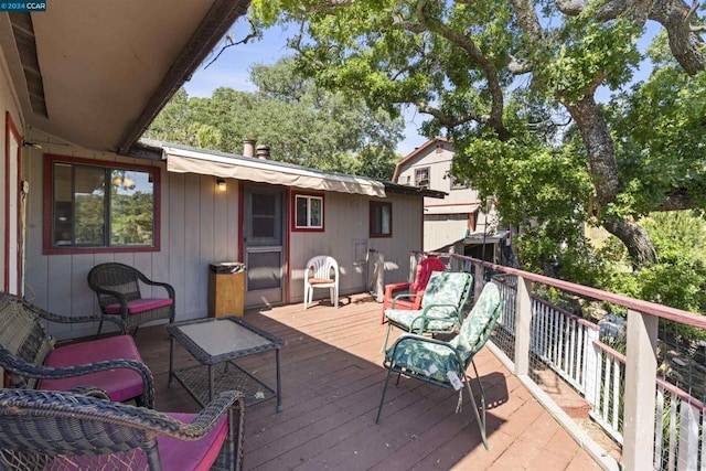 wooden deck featuring an outdoor hangout area