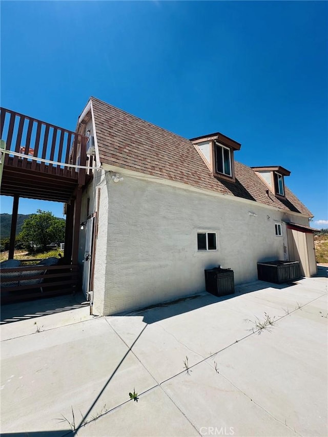 view of home's exterior with a patio area