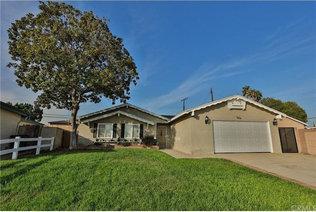 view of front of property featuring a front lawn and a garage