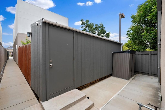 view of side of home featuring a patio area