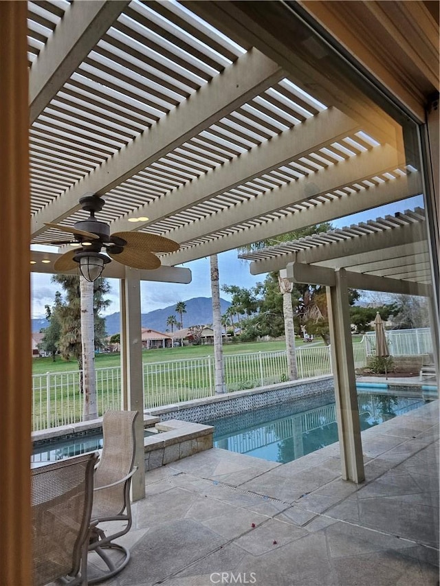 view of swimming pool featuring a mountain view, a pergola, and a patio