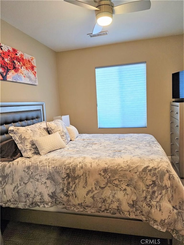 bedroom featuring ceiling fan and carpet floors