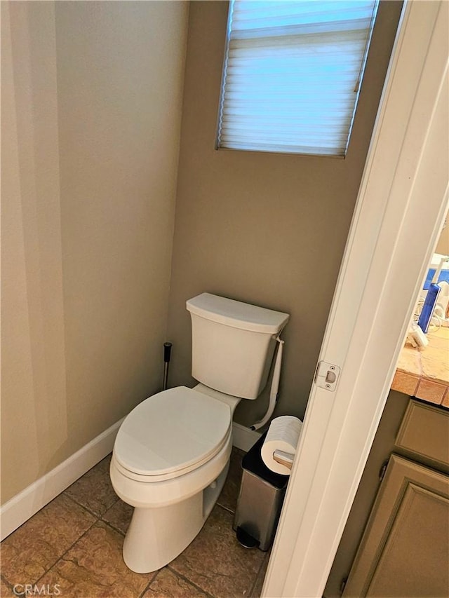 bathroom featuring tile patterned floors and toilet