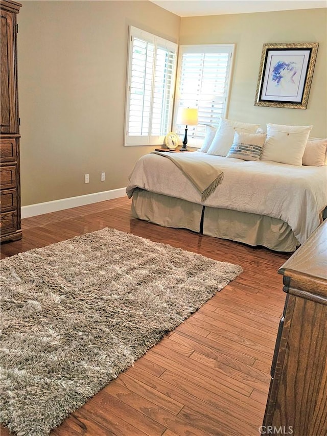 bedroom with hardwood / wood-style floors