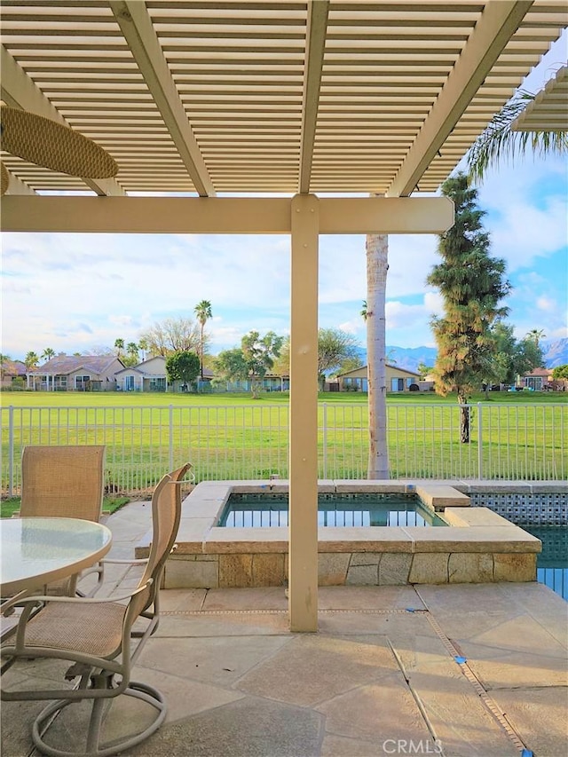 view of patio with a pergola and a swimming pool with hot tub