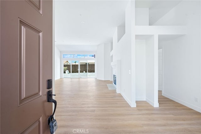 hallway with light wood-type flooring