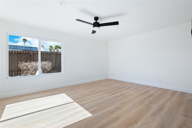 spare room with ceiling fan and light hardwood / wood-style floors