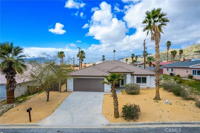 single story home featuring a garage