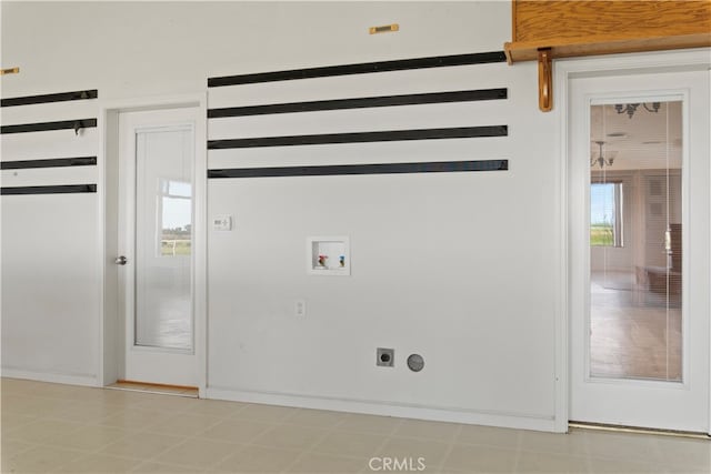 clothes washing area with hookup for a washing machine, tile flooring, and electric dryer hookup