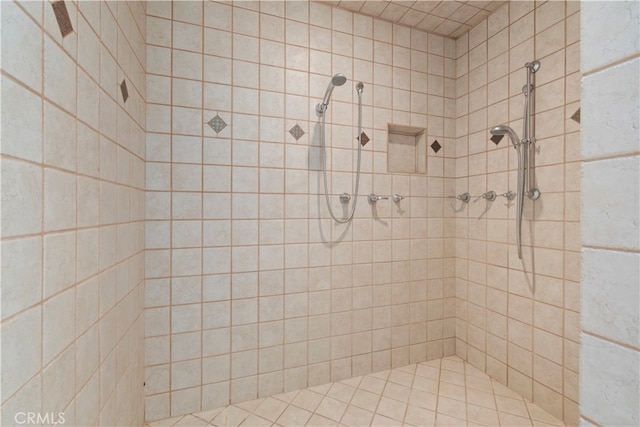 bathroom with tiled shower