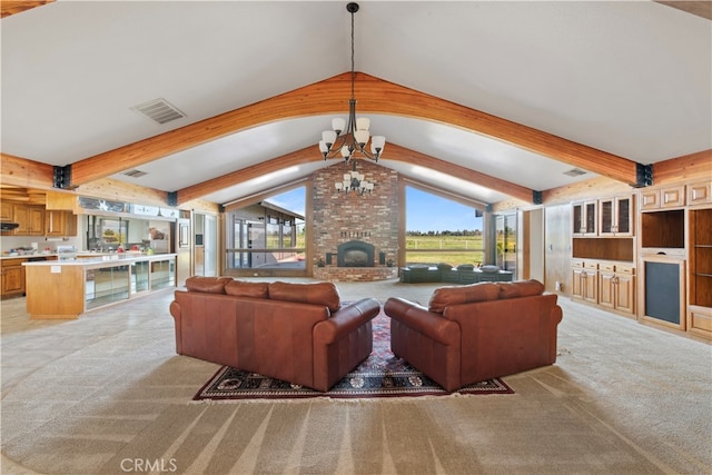 carpeted living room with vaulted ceiling with beams, brick wall, a chandelier, and a brick fireplace