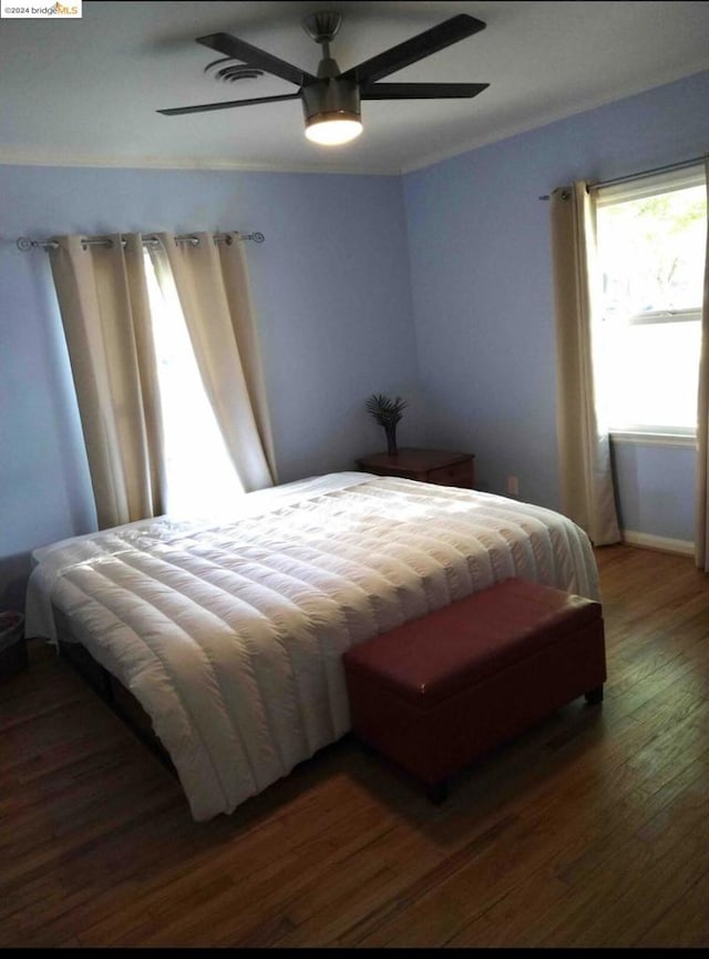 bedroom featuring dark wood-type flooring and ceiling fan