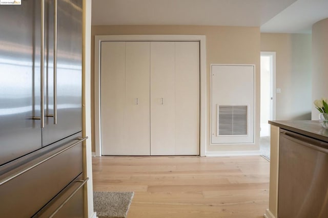 interior space with stainless steel appliances and light hardwood / wood-style flooring