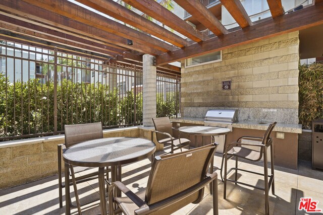 view of patio with a pergola, a grill, and area for grilling