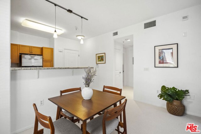 view of carpeted dining room