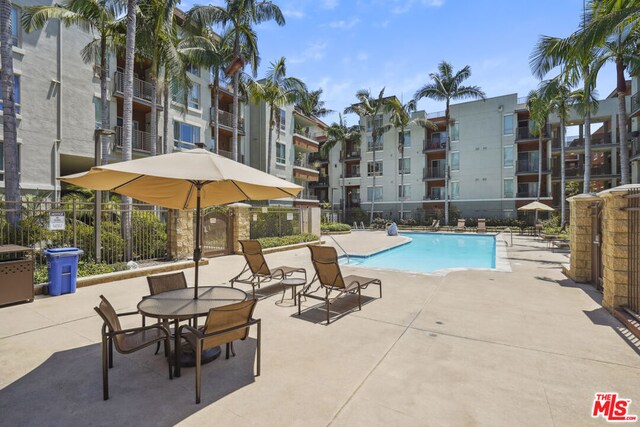 view of swimming pool featuring a patio