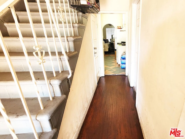 hall with wood-type flooring