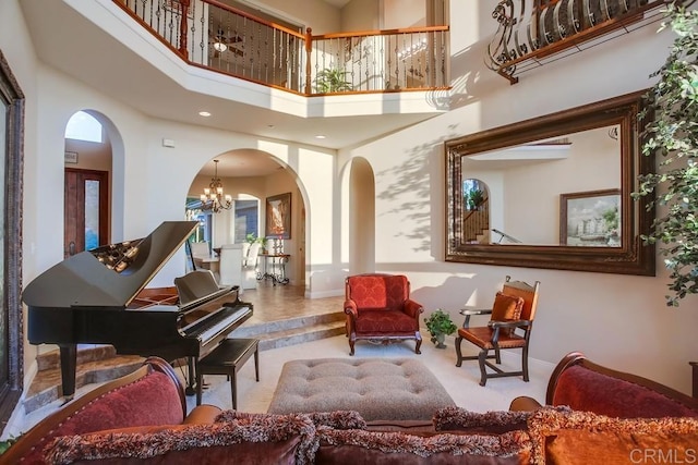 interior space featuring a notable chandelier and a high ceiling