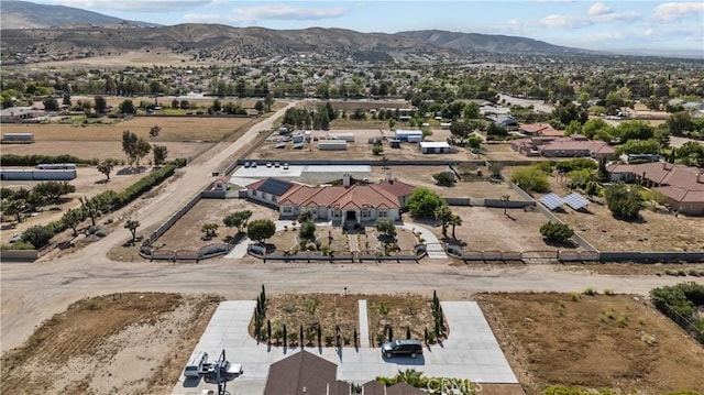 birds eye view of property with a mountain view