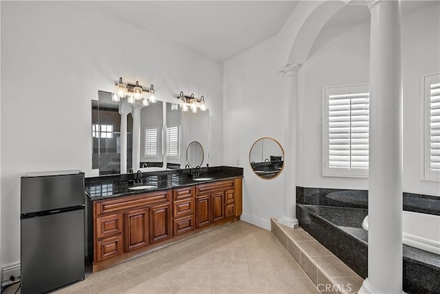 bathroom featuring tile patterned flooring, vanity, and decorative columns