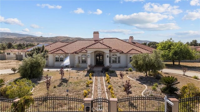 mediterranean / spanish-style home featuring a mountain view