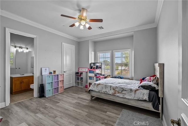 bedroom featuring ensuite bath, ornamental molding, ceiling fan, sink, and light hardwood / wood-style floors