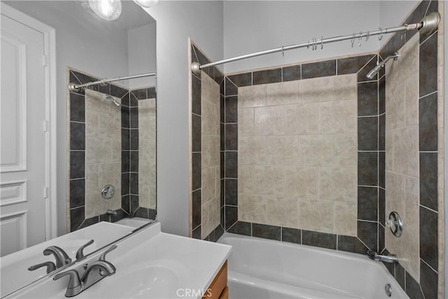 bathroom with vanity and tiled shower / bath combo