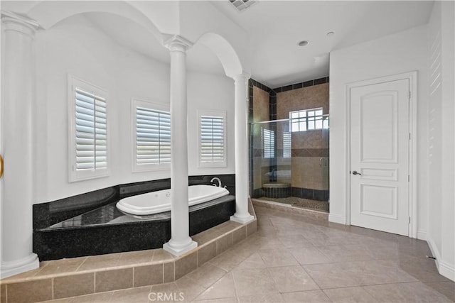 bathroom featuring tile patterned floors and shower with separate bathtub