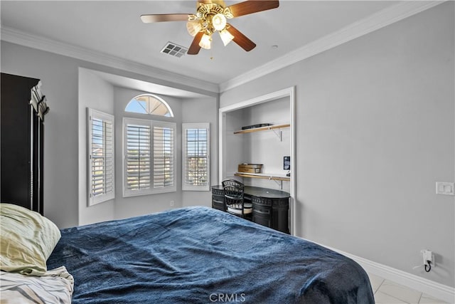 bedroom with a closet, ceiling fan, and crown molding