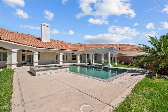 view of swimming pool with an in ground hot tub, a pergola, and a patio area