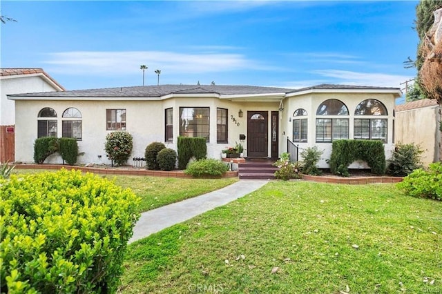 ranch-style home with a front yard