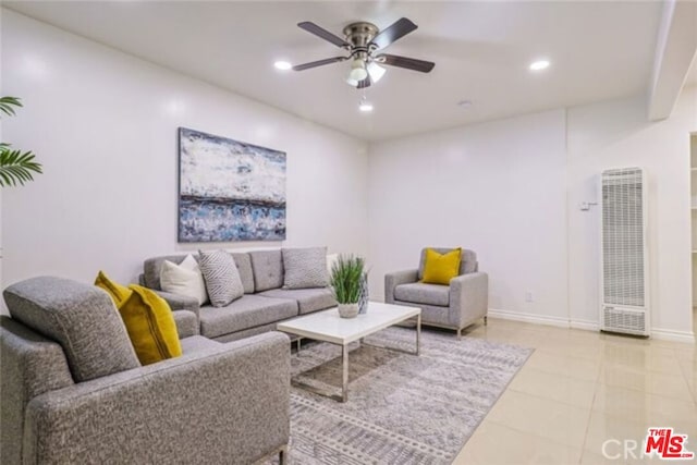 tiled living room featuring ceiling fan