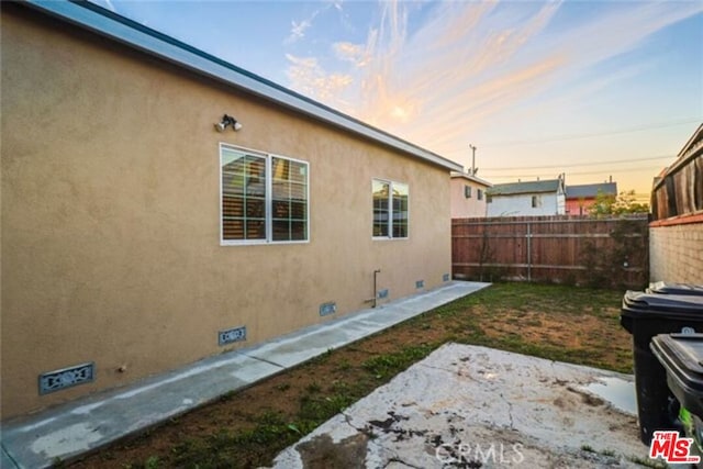 view of property exterior at dusk