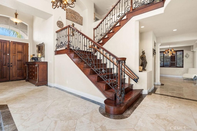 entrance foyer featuring a high ceiling and a chandelier