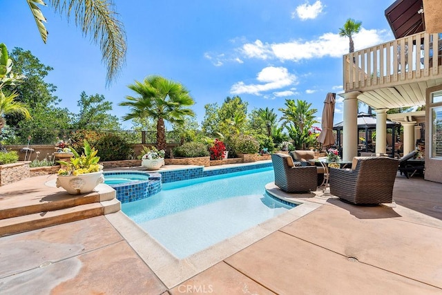 view of swimming pool featuring a patio area, an in ground hot tub, and outdoor lounge area