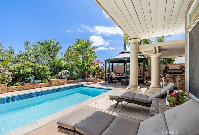 view of pool featuring a gazebo and a patio area