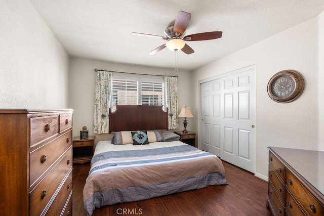 bedroom featuring a closet, ceiling fan, and dark hardwood / wood-style flooring