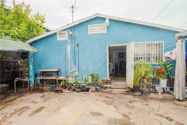 rear view of house with a patio area