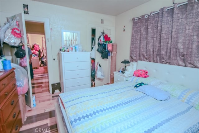 bedroom featuring hardwood / wood-style flooring