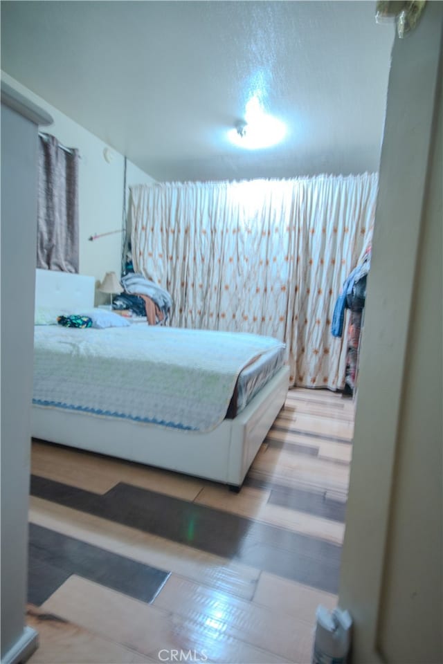 bedroom with hardwood / wood-style flooring