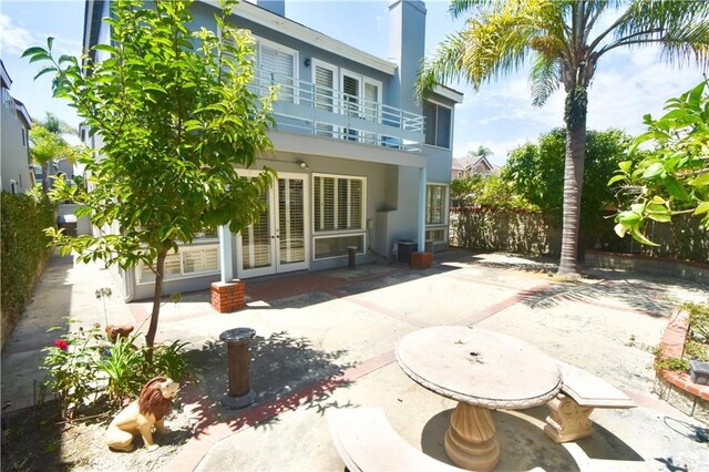 back of property featuring a patio area and central AC